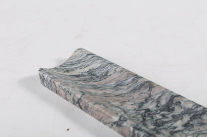 Koville natural marble incense holder in Rosso Luana with burning incense stick
