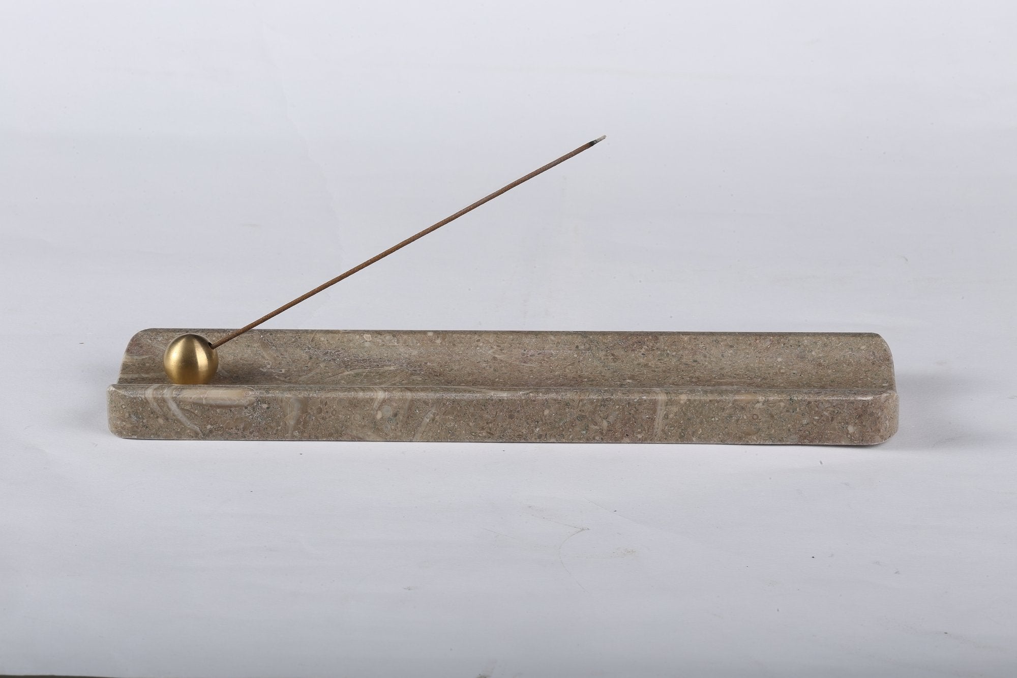 Koville natural marble incense holder in Rustic Green Light with burning incense stick