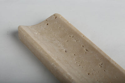 Koville incense holder in Travertino Romano with burning incense stick