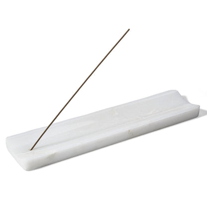 Koville natural marble incense holder slanted hole in Namib Bianco with burning incense stick