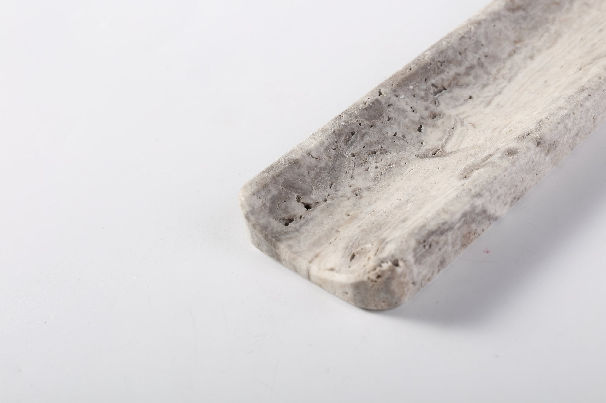 Koville natural marble incense holder slanted hole in Travertine Silver with burning incense stick