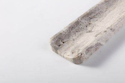 Koville natural marble incense holder slanted hole in Travertine Silver with burning incense stick