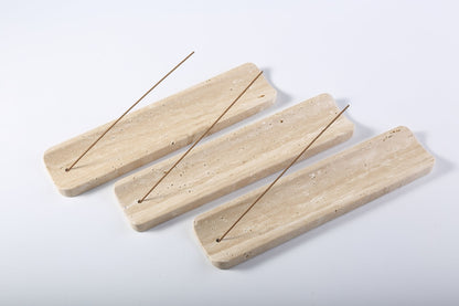 Koville natural marble incense holder slanted hole in Travertino Romano with burning incense stick