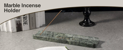 Koville natural marble incense holder slanted hole in Verde Alpi with burning incense stick