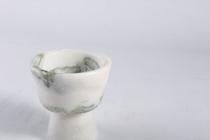 Koville natural marble king cup diffuser in Bianco Palomino on a shelf diffusing essential oils