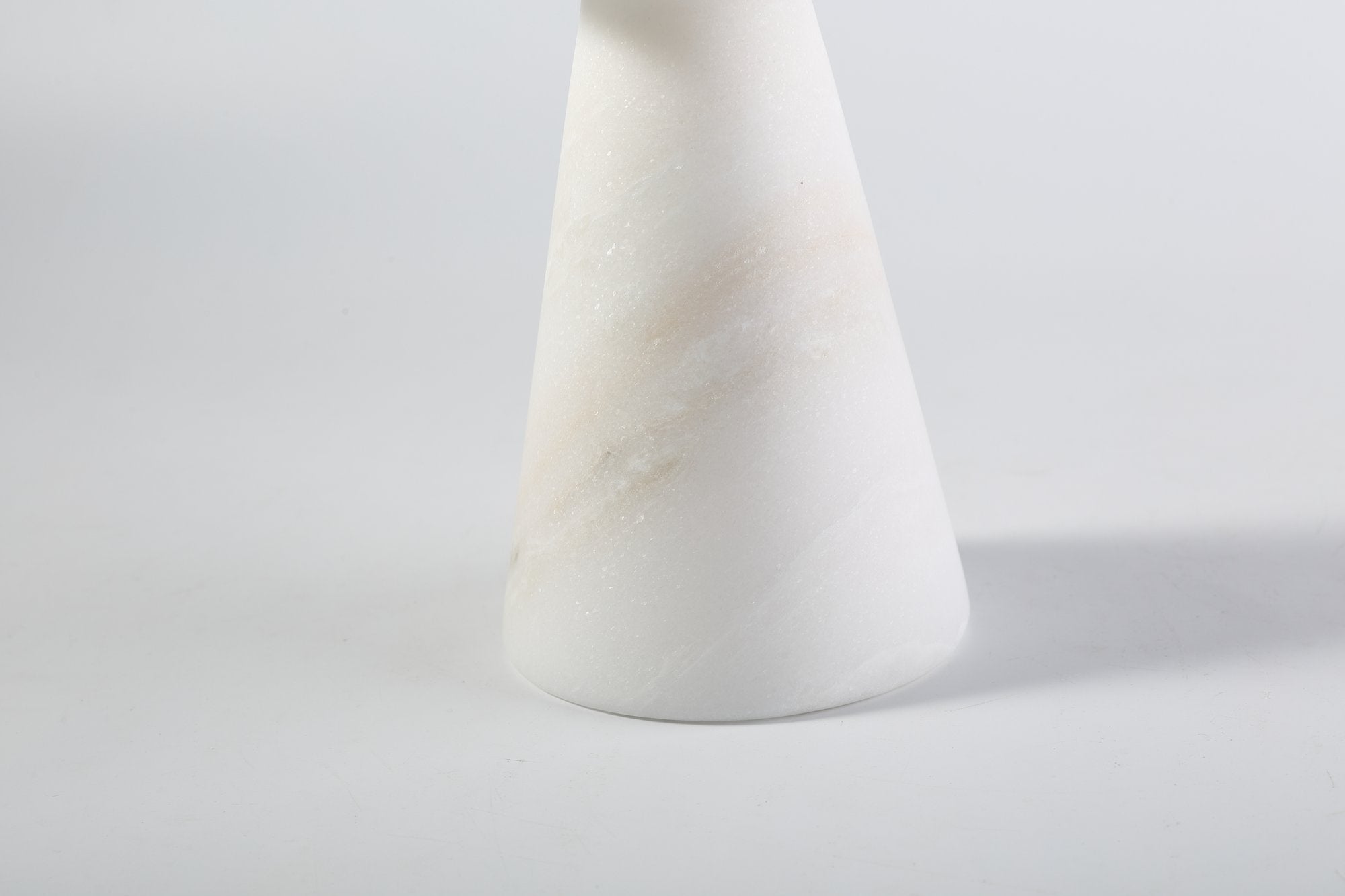 Koville natural marble lighthouse candle holder h 203 2 in Namib Bianco with a lit tea light candle