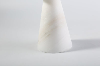 Koville candlestick in Namib Bianco with a lit tea light candle