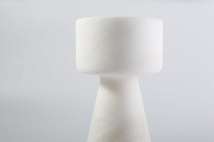 Koville natural marble lighthouse candle holder h 203 2 in Namib Bianco with a lit tea light candle