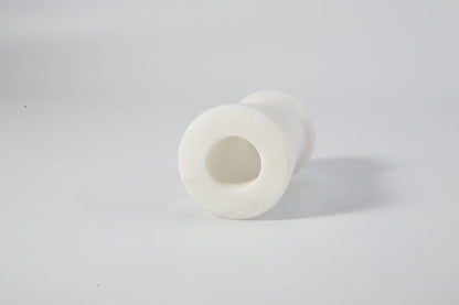 Koville natural marble orbit candle holder d 50 in Namib Bianco with a lit tea light candle