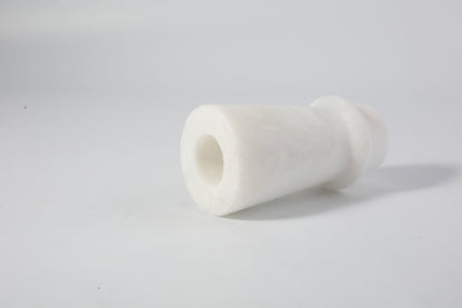 Koville natural marble orbit candle holder d 50 in Namib Bianco with a lit tea light candle