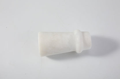Koville natural marble orbit candle holder d 50 in Namib Bianco with a lit tea light candle