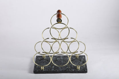 Koville Natural Stone Wine Rack in Blue Pearl on a kitchen counter holding wine bottles