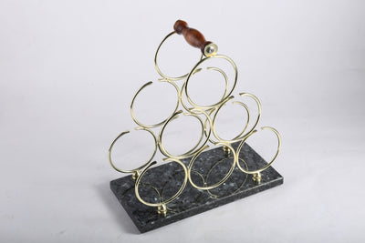 Koville Natural Stone Wine Rack in Blue Pearl on a kitchen counter holding wine bottles