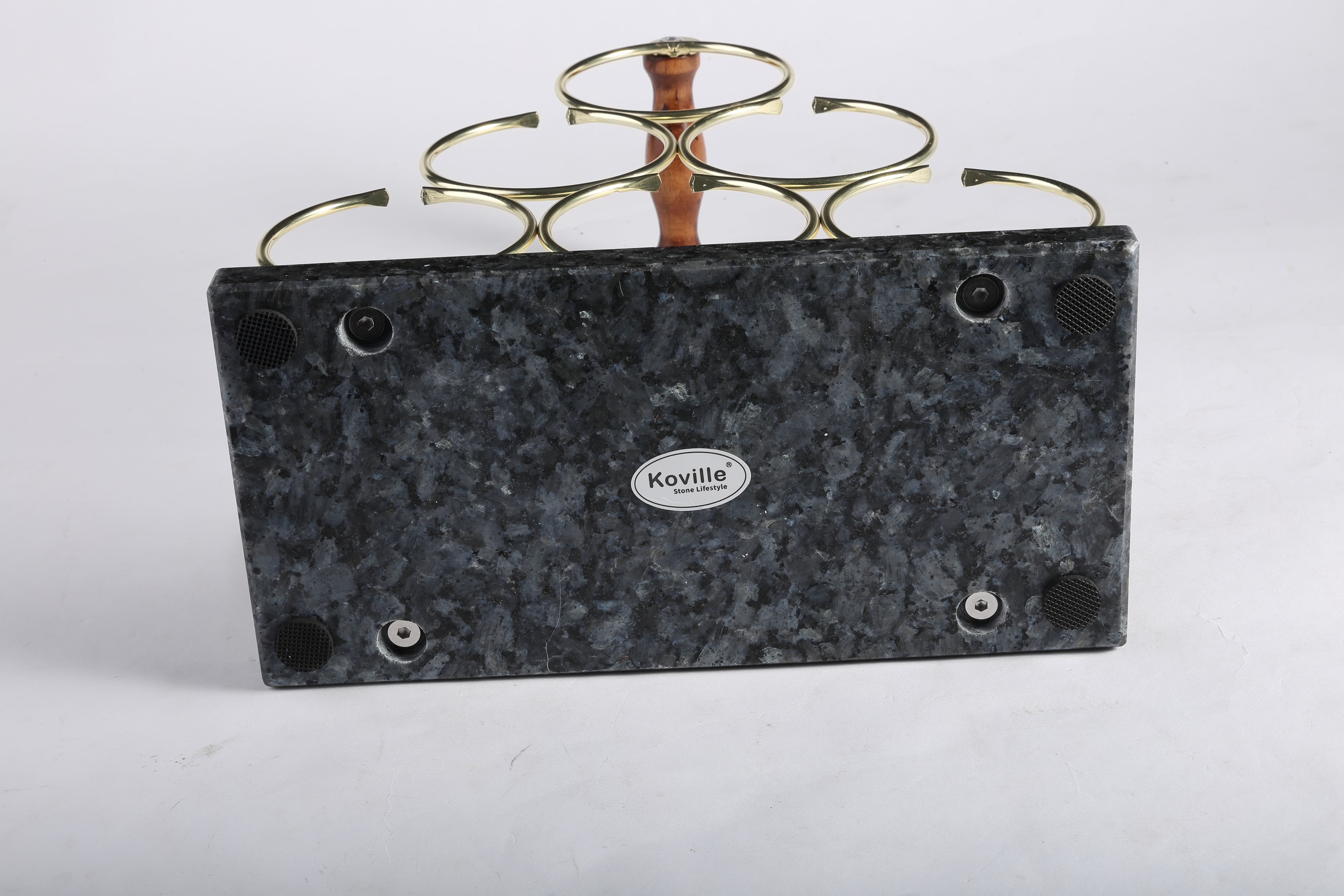 Koville Natural Stone Wine Rack in Blue Pearl on a kitchen counter holding wine bottles