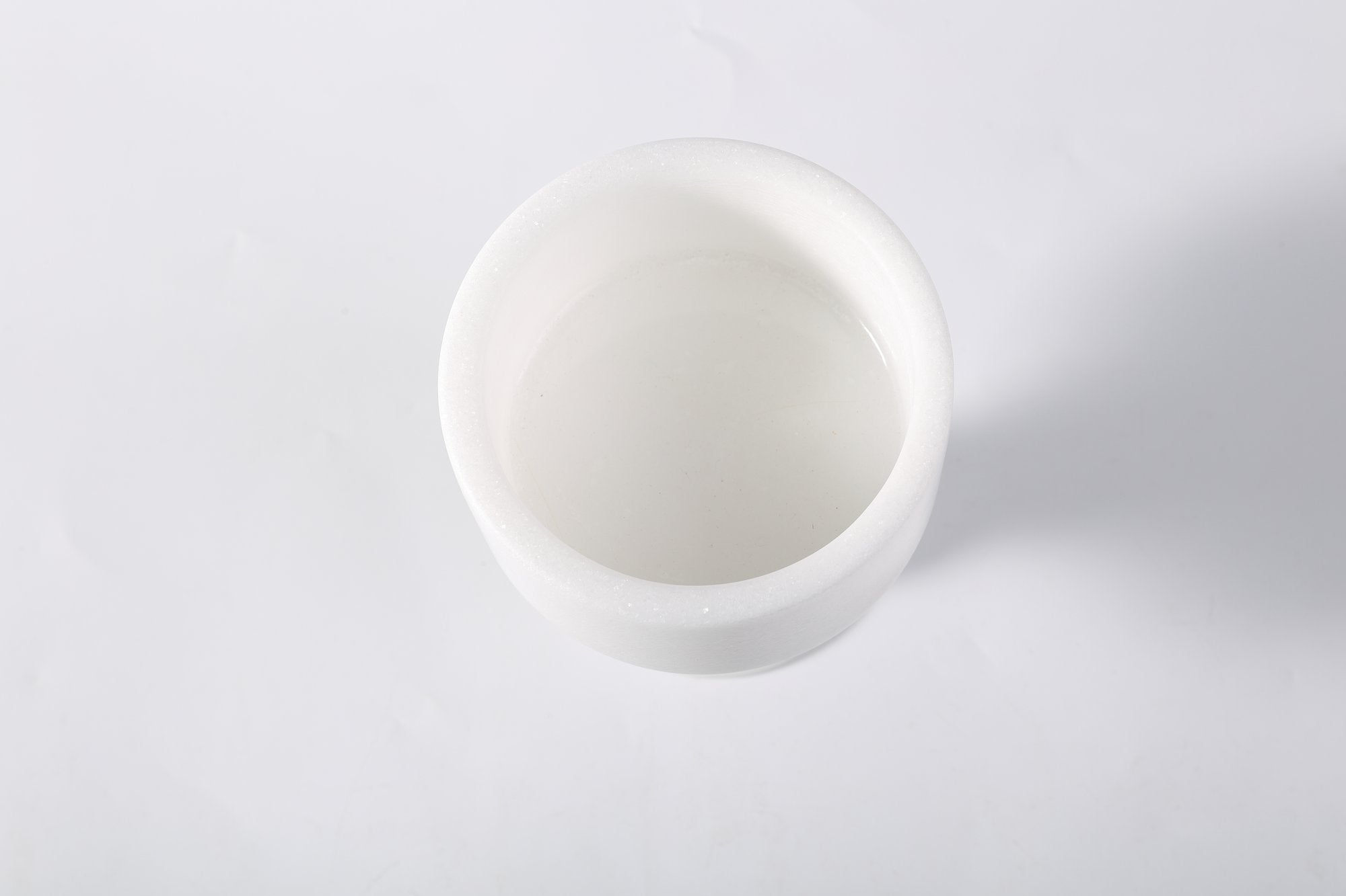 Koville natural marble storage cup 98 125 in Namib Bianco with lid on a vanity counter