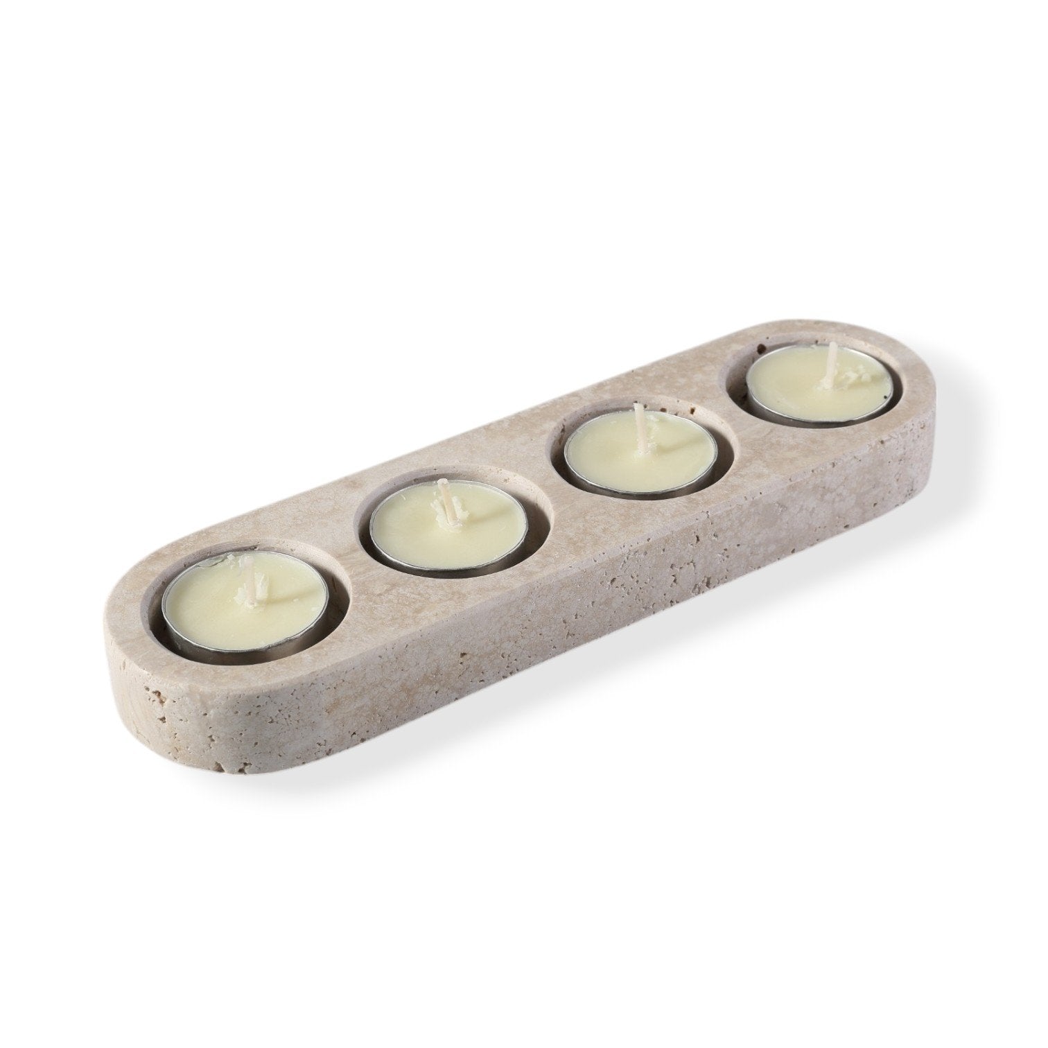 Koville natural marble tea light candle holder 4 holes in Travertino Romano with a lit tea light candle