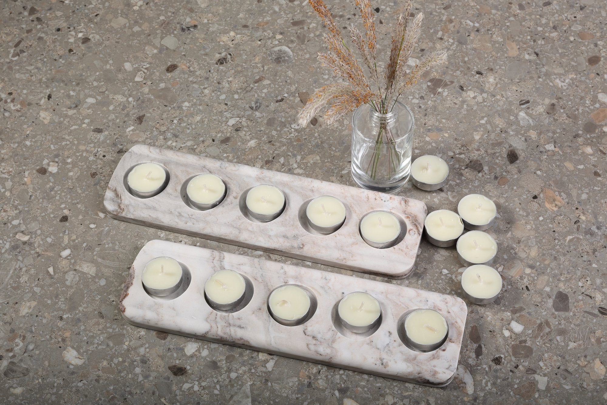 Koville natural marble tea light candle holder 5 holes in Palissandro Classico with a lit tea light candle