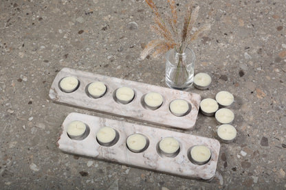 Koville natural marble tea light candle holder 5 holes in Palissandro Classico with a lit tea light candle