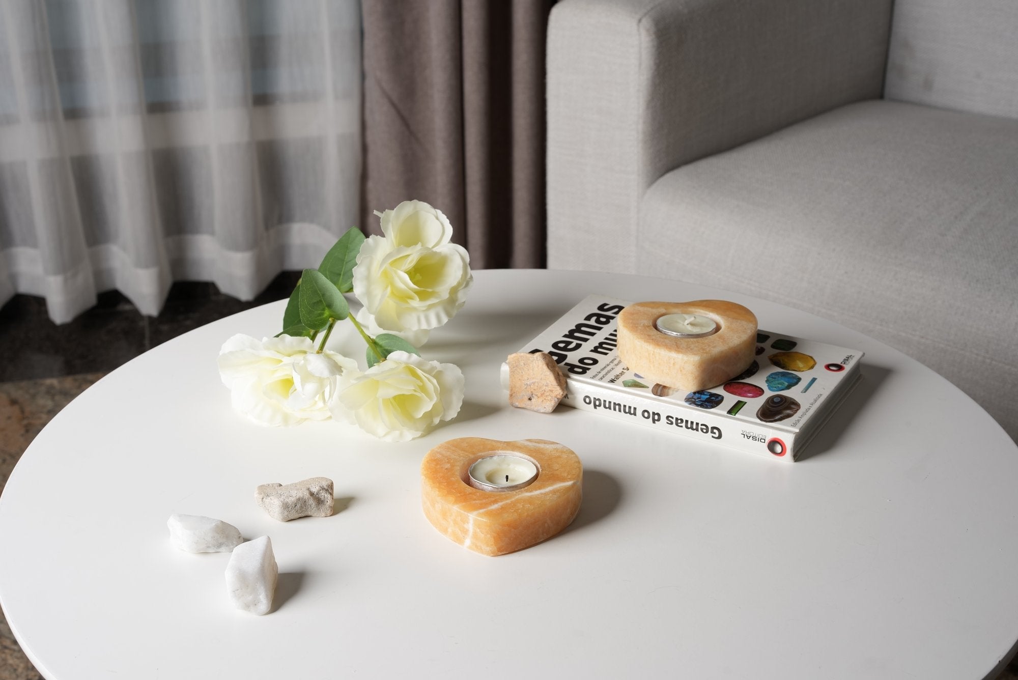 Koville natural marble tea light candle holder t 25 in Orange Onyx with a lit tea light candle