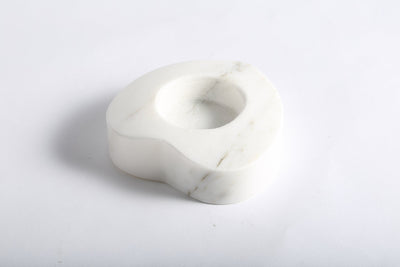 Koville tea light candle holder in Sivec with a lit tea light candle