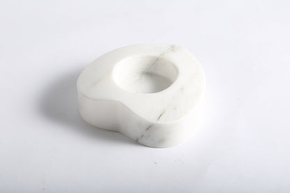 Koville natural marble tea light candle holder t 30 in Sivec with a lit tea light candle