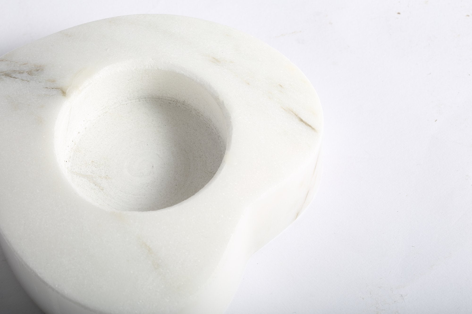 Koville natural marble tea light candle holder t 30 in Sivec with a lit tea light candle